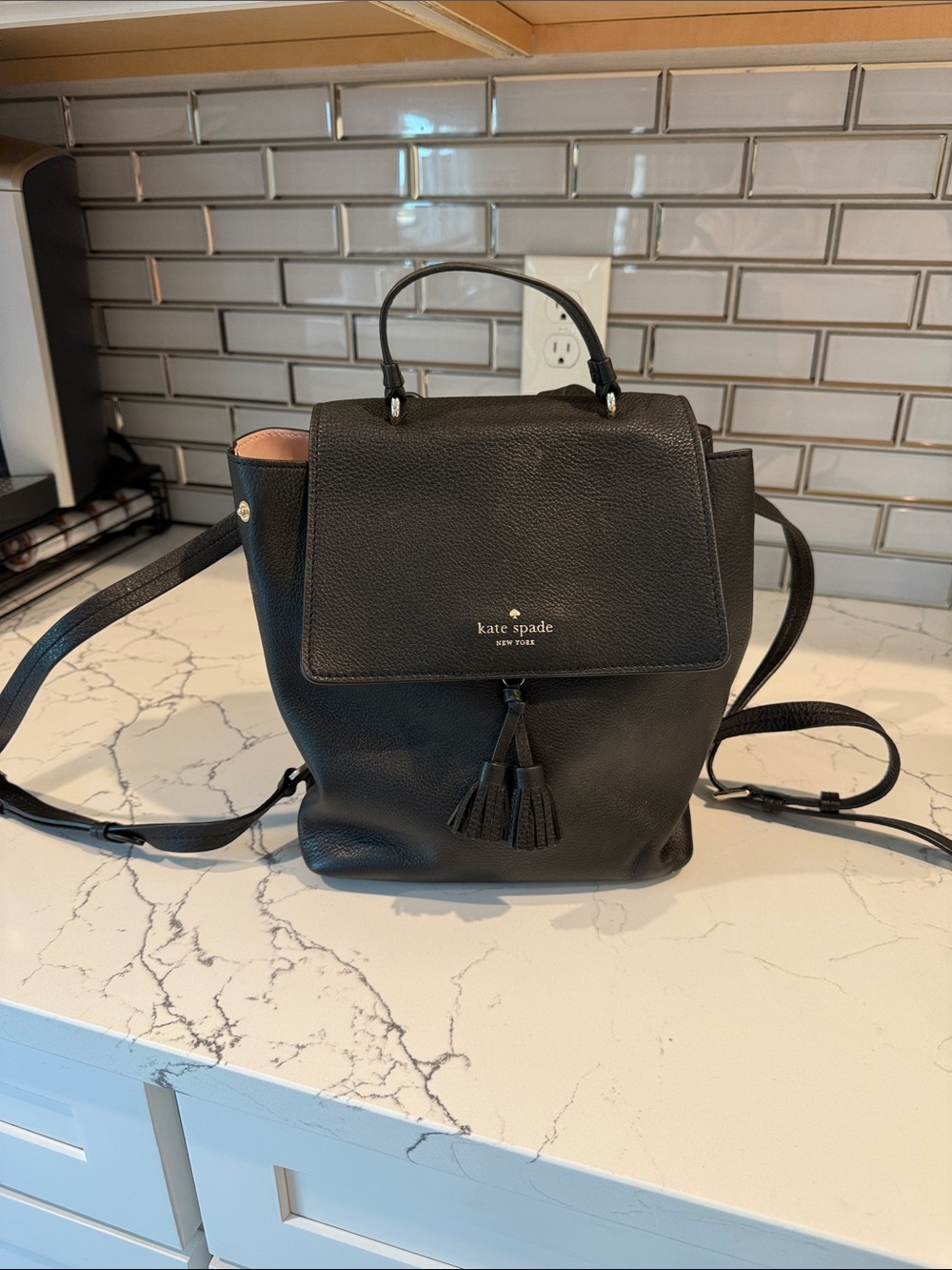 kate spade Black Pebbled Leather Backpack with Tassel